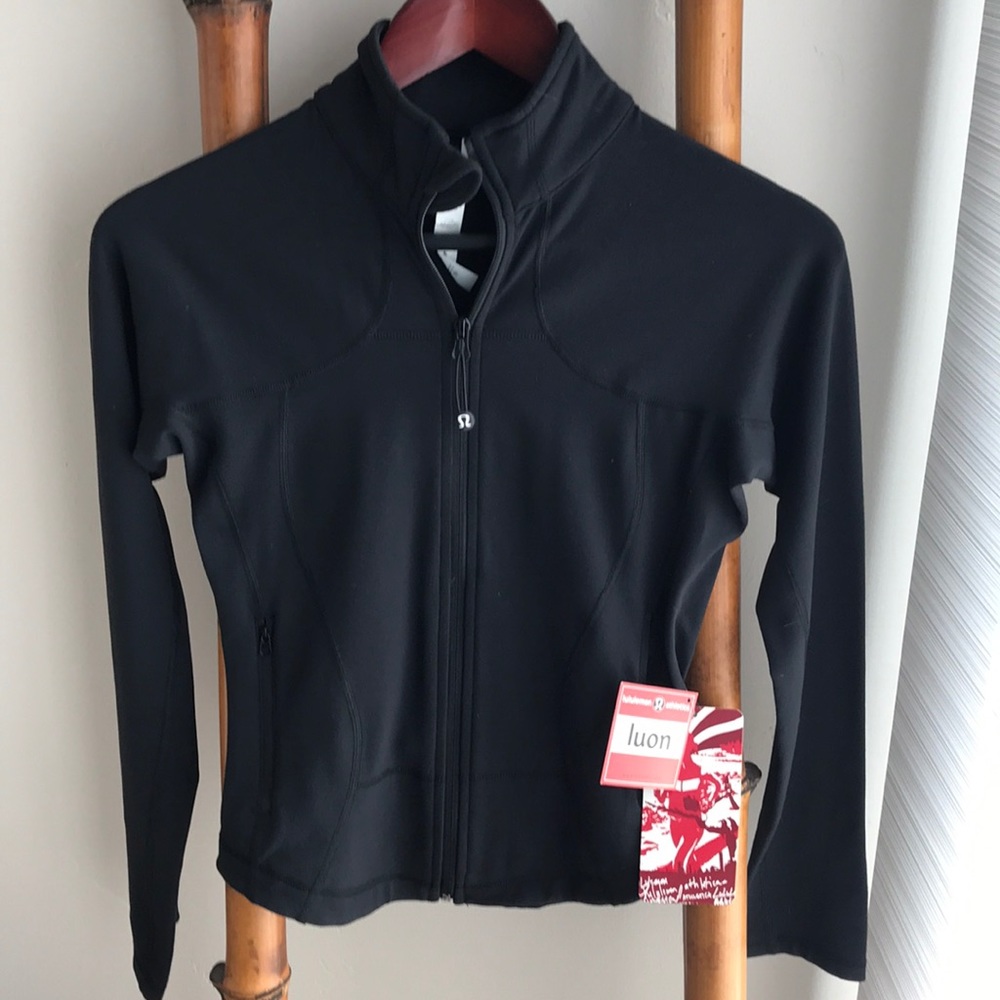 Shape Warm Up Jacket Size 4. 85% nylon 13% spandex